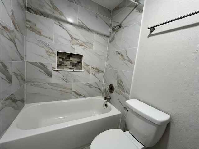 10555 Turtlewood Ct Unit 1008, Houston, TX 77072 - bathroom featuring shower / bathtub combination, toilet, and a textured wall
