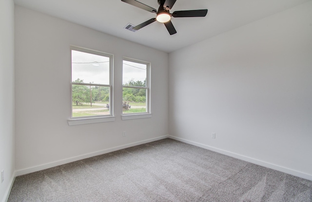 1920 1st St, Hempstead, TX 77445 - spare room with visible vents, a ceiling fan, baseboards, and carpet floors