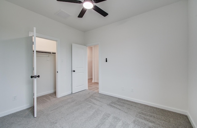 1920 1st St, Hempstead, TX 77445 - unfurnished bedroom with visible vents, a ceiling fan, carpet floors, a closet, and baseboards