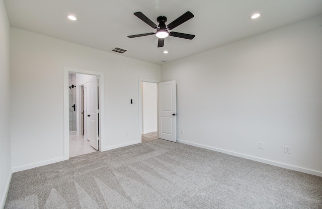 1920 1st St, Hempstead, TX 77445 - unfurnished bedroom with baseboards, visible vents, recessed lighting, and light colored carpet