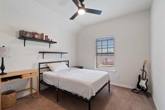 carpeted bedroom featuring lofted ceiling, baseboards, and ceiling fan