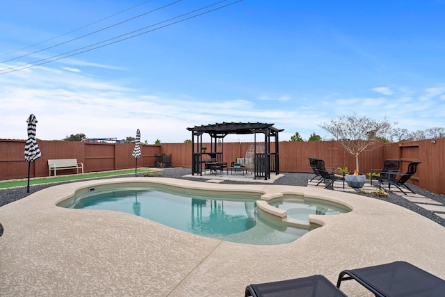 view of swimming pool with a pergola, a fenced backyard, a pool with connected hot tub, and a patio