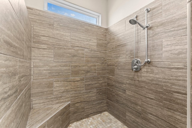 full bathroom with a tile shower