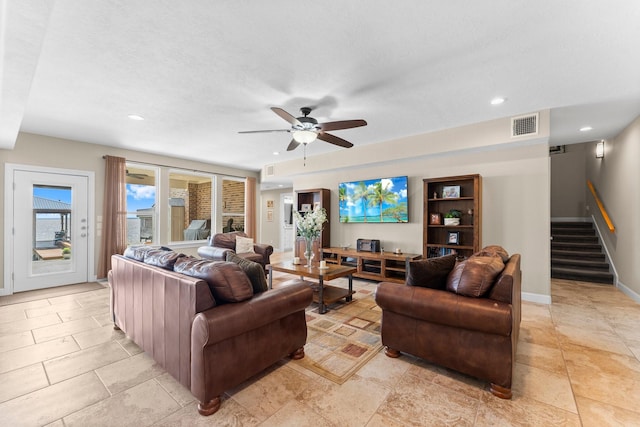 living room featuring recessed lighting, visible vents, baseboards, stairs, and ceiling fan