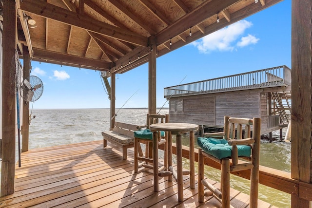 wooden deck featuring a water view