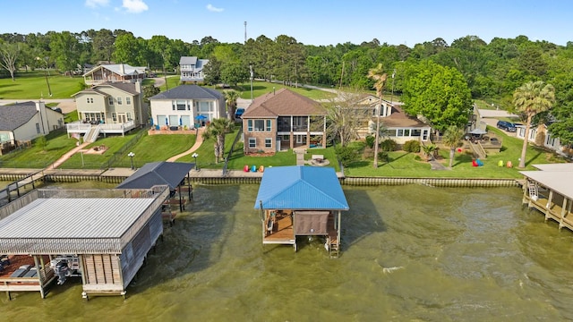 drone / aerial view with a residential view and a water view