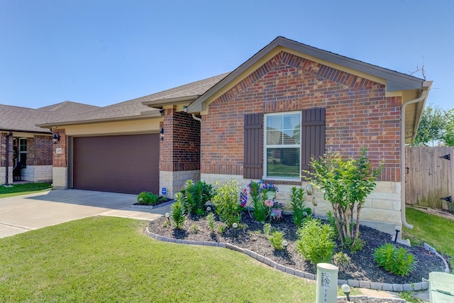 view of front of home with a front lawn, concrete driveway, fence, brick siding, and a garage