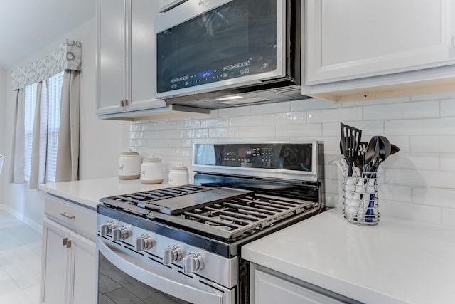 kitchen featuring white cabinetry and stainless steel appliances