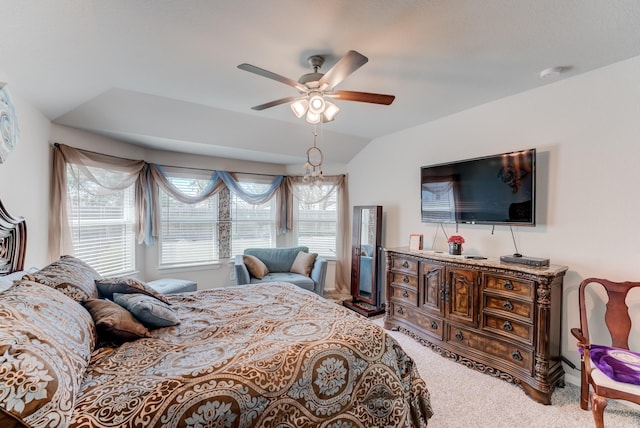 bedroom with carpet floors, lofted ceiling, and ceiling fan