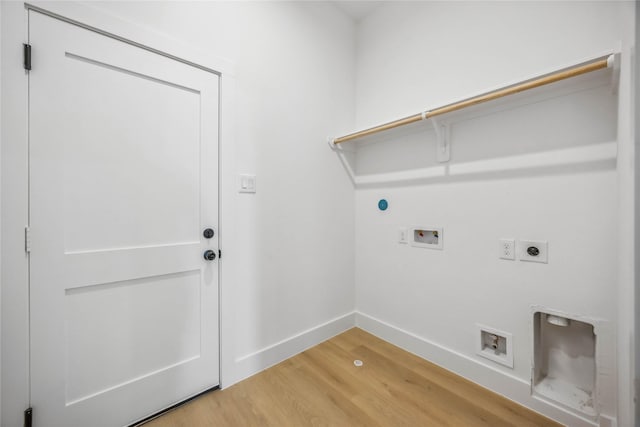 clothes washing area featuring washer hookup, hookup for an electric dryer, laundry area, baseboards, and light wood-style floors