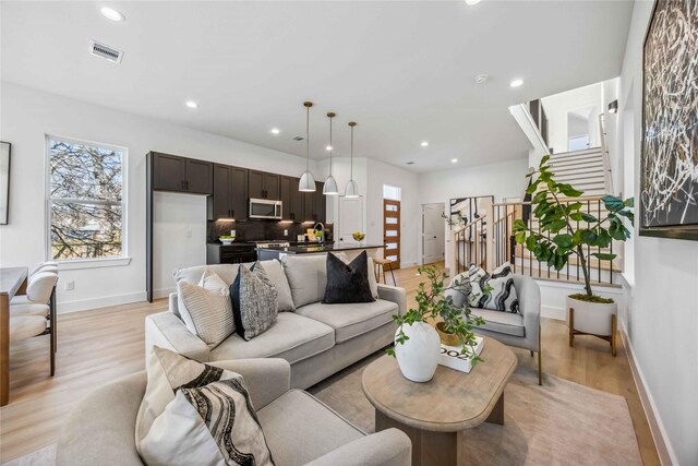 3323 Rogers St, Houston, TX 77022 - living room with recessed lighting, baseboards, visible vents, and light wood-style flooring
