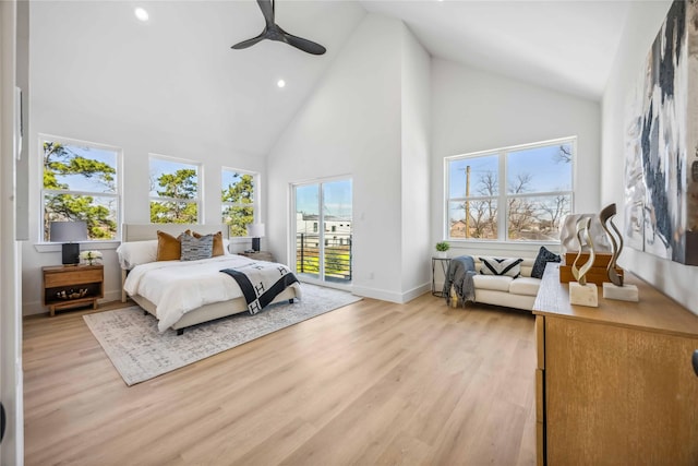 bedroom with access to exterior, baseboards, light wood-style floors, high vaulted ceiling, and recessed lighting