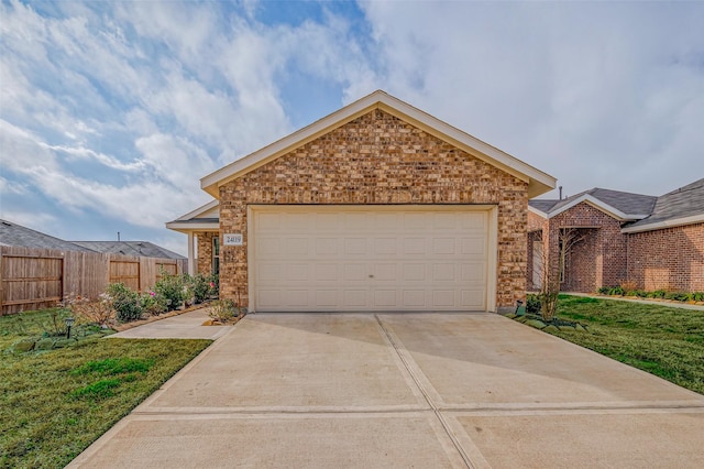 24119 Maple Turn Ln, Hockley, TX 77447 - view of front facade featuring brick siding, a garage, concrete driveway, and fence