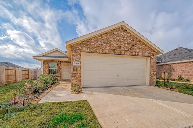24119 Maple Turn Ln, Hockley, TX 77447 - view of front facade featuring fence, brick siding, a garage, and concrete driveway