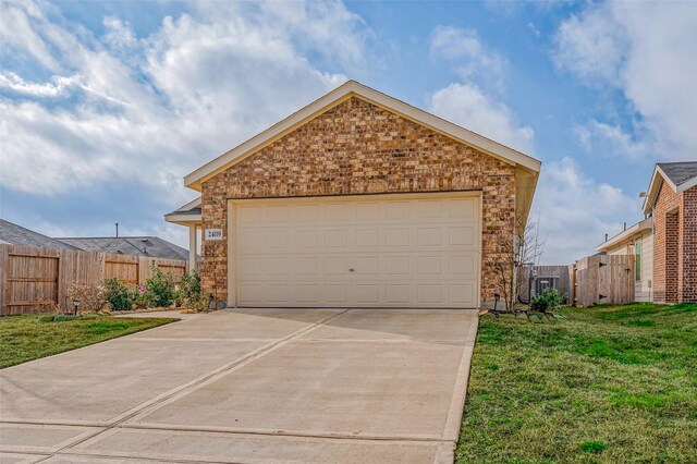 24119 Maple Turn Ln, Hockley, TX 77447 - view of front of property featuring fence, concrete driveway, brick siding, a front yard, and a garage