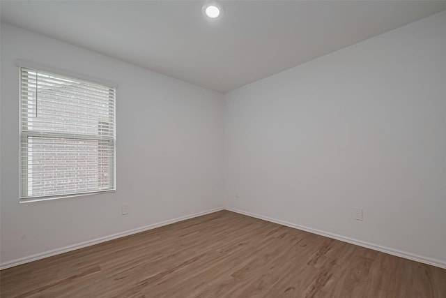 24119 Maple Turn Ln, Hockley, TX 77447 - unfurnished room with baseboards and wood finished floors