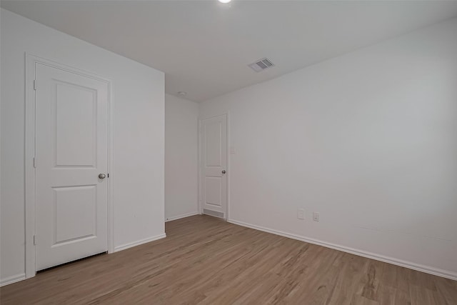 24119 Maple Turn Ln, Hockley, TX 77447 - unfurnished bedroom featuring light wood-style floors, visible vents, and baseboards