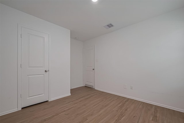 24119 Maple Turn Ln, Hockley, TX 77447 - spare room with light wood-type flooring, baseboards, and visible vents