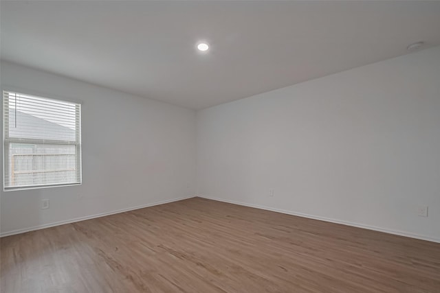 24119 Maple Turn Ln, Hockley, TX 77447 - spare room featuring light wood-type flooring, baseboards, and recessed lighting