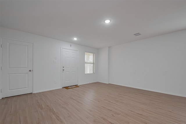 24119 Maple Turn Ln, Hockley, TX 77447 - entryway featuring light wood-type flooring, baseboards, recessed lighting, and visible vents