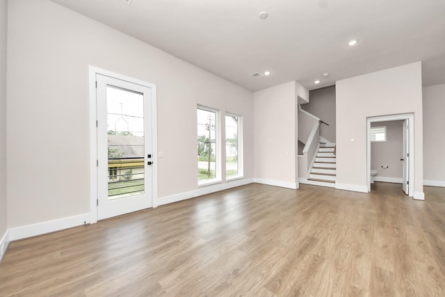783 Mansfield St, Houston, TX 77091 - unfurnished living room featuring recessed lighting, light wood-style floors, stairway, and baseboards