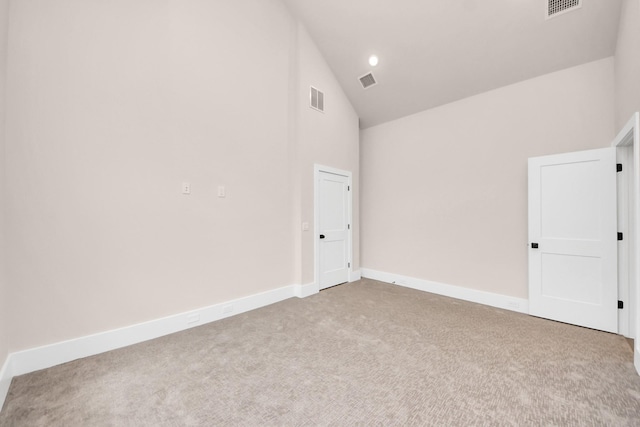 783 Mansfield St, Houston, TX 77091 - empty room featuring high vaulted ceiling, baseboards, visible vents, and carpet
