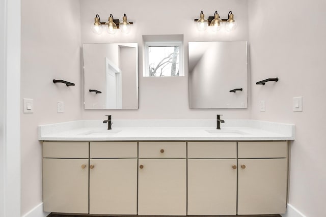 783 Mansfield St, Houston, TX 77091 - full bathroom with double vanity, baseboards, and a sink