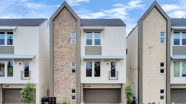 783 Mansfield St, Houston, TX 77091 - view of front of home featuring brick siding and an attached garage
