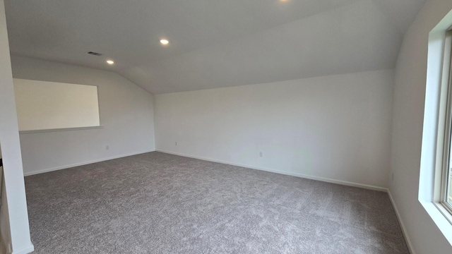 bonus room featuring lofted ceiling, baseboards, carpet floors, and recessed lighting