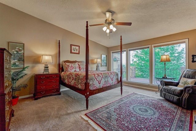 11831 Thoreau Dr, Montgomery, TX 77356 - carpeted bedroom featuring lofted ceiling, a textured ceiling, a ceiling fan, and baseboards