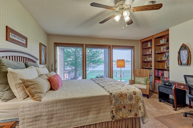 11831 Thoreau Dr, Montgomery, TX 77356 - bedroom with light carpet, a textured ceiling, and ceiling fan