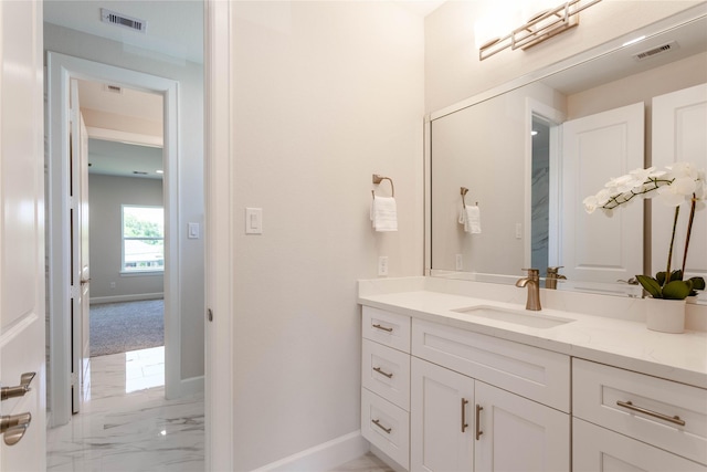 1114 Niagara St, Houston, TX 77051 - bathroom with baseboards, vanity, visible vents, and marble finish floor