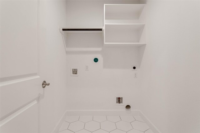 1114 Niagara St, Houston, TX 77051 - laundry room featuring hookup for a washing machine, hookup for an electric dryer, baseboards, tile patterned flooring, and laundry area
