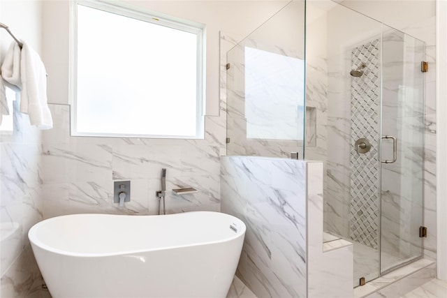 1114 Niagara St, Houston, TX 77051 - full bath featuring a shower stall, a freestanding bath, and tile walls