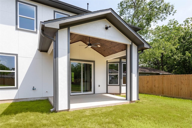1114 Niagara St, Houston, TX 77051 - rear view of house featuring a patio, ceiling fan, a lawn, stucco siding, and fence