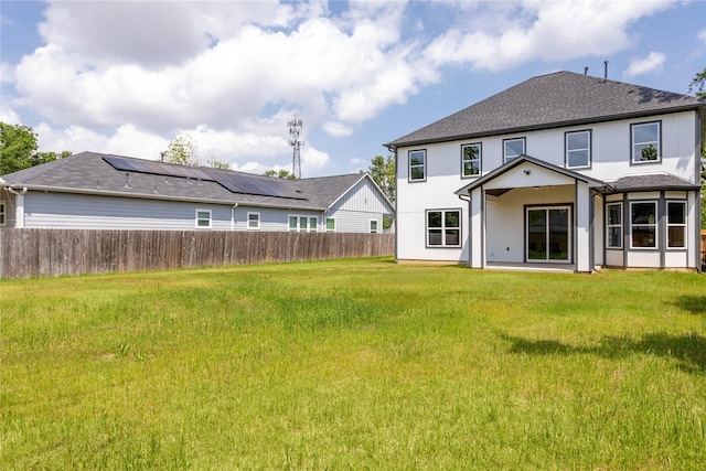 1114 Niagara St, Houston, TX 77051 - rear view of house with fence, roof with shingles, a lawn, and stucco siding
