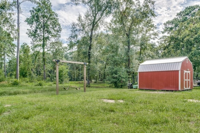 view of yard with a storage unit and an outbuilding