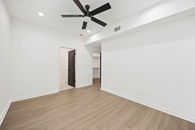 empty room with recessed lighting, light wood-style flooring, visible vents, and a ceiling fan
