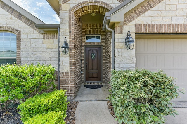 3754 Paladera Place Ct, Spring, TX 77386 - view of exterior entry featuring an attached garage and stone siding