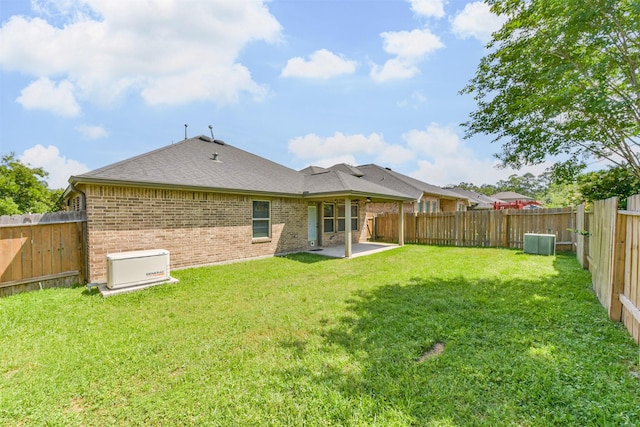 3754 Paladera Place Ct, Spring, TX 77386 - back of property with a fenced backyard, a patio area, a yard, and brick siding