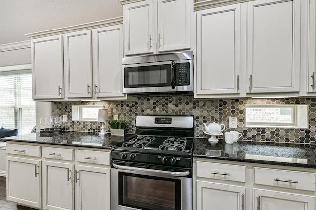 3754 Paladera Place Ct, Spring, TX 77386 - kitchen featuring appliances with stainless steel finishes, tasteful backsplash, and dark stone countertops
