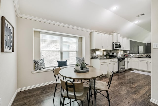 3754 Paladera Place Ct, Spring, TX 77386 - dining area with visible vents, baseboards, lofted ceiling, ornamental molding, and dark wood-style floors
