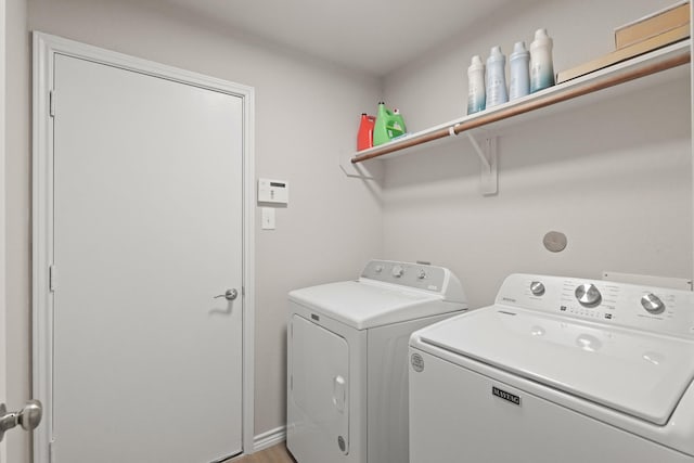 washroom featuring laundry area and washer and clothes dryer