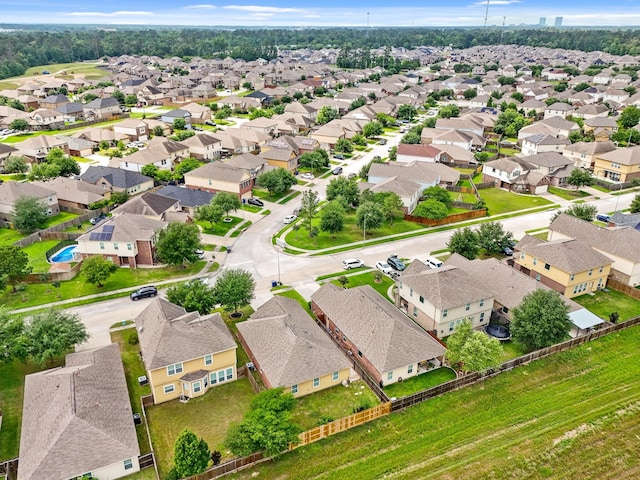birds eye view of property with a residential view
