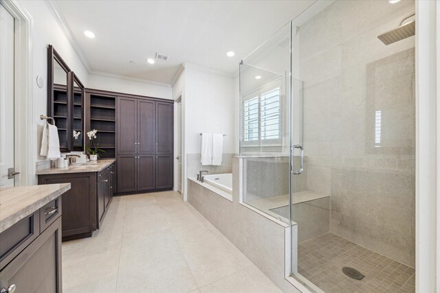 full bath featuring tile patterned floors, a stall shower, a bath, vanity, and ornamental molding