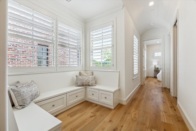 living area with recessed lighting, light wood finished floors, baseboards, and ornamental molding