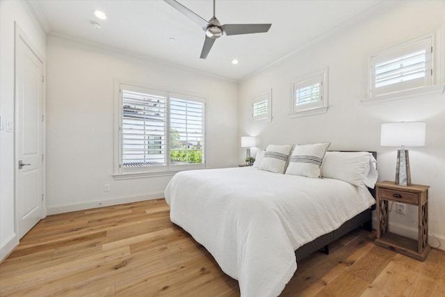 bedroom featuring recessed lighting, light wood-style floors, baseboards, and ornamental molding
