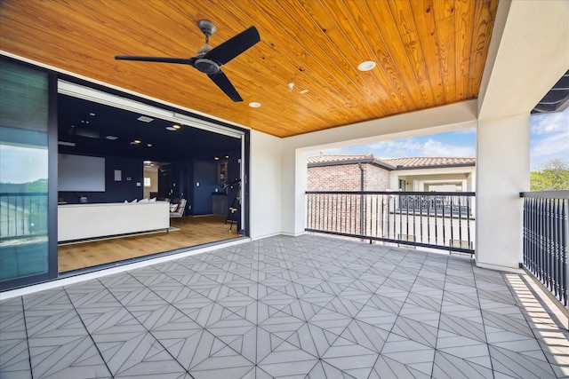 view of patio / terrace with a ceiling fan and a balcony