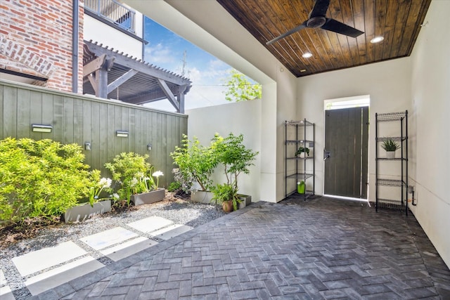 view of patio featuring a pergola and ceiling fan