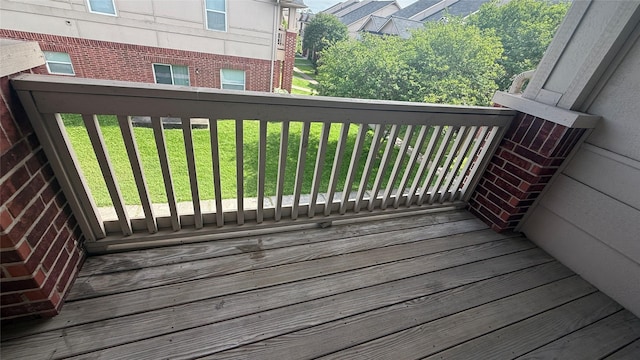 wooden deck with a lawn